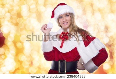 Beautiful young girl in a Christmas costume. New Year\'s holidays. Woman celebrating Christmas
