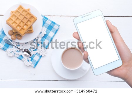Girl photographs on a mobile phone food. Mobile technology. Mobile photo. Insert text