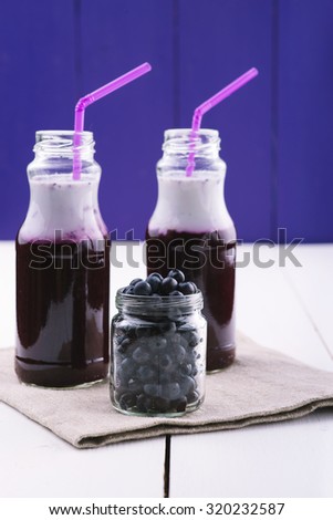 Refreshing blueberry smoothie. Fruit cocktail. Delicious vitamin smoothies. Healthy food. Fruit diet. Wooden board rustic