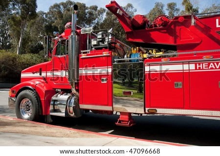 Heavy duty fire truck parked at curb