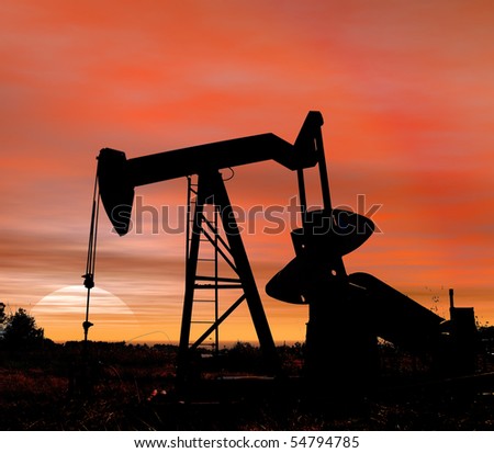 Stock photo of an oil pumper at sunset in near square format