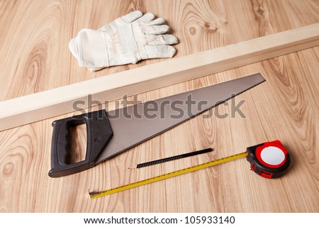 Photo of carpenter tools and building plan