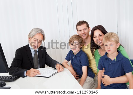 Young family consulting at business advisor office