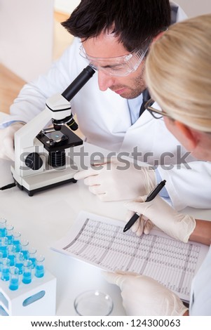 Two lab technicians at work in a laboratory