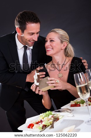 Romantic couple sitting having dinner in an elegant restaurant