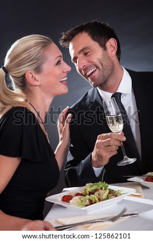 http://image.shutterstock.com/display_pic_with_logo/514156/125862101/stock-photo-romantic-couple-sitting-having-dinner-in-an-elegant-restaurant-125862101.jpg