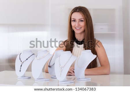 Young Beautiful Woman Working In Jewelry Shop
