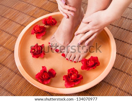 Close-up Of Female Feet Getting Spa Aroma Therapy
