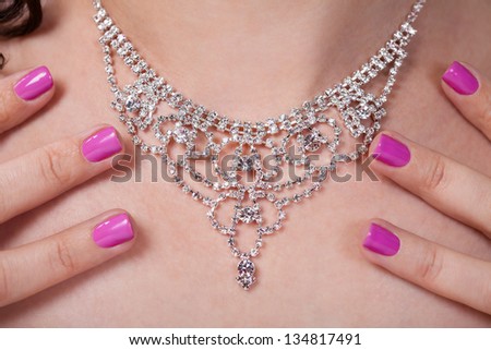 Close-up Of Woman\'s Neck And Her Beautiful Necklace