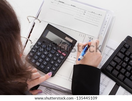 Close-up Of Accountant Woman Working In Office