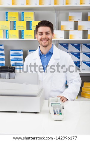 Portrait Of Happy Male Pharmacist In Pharmacy