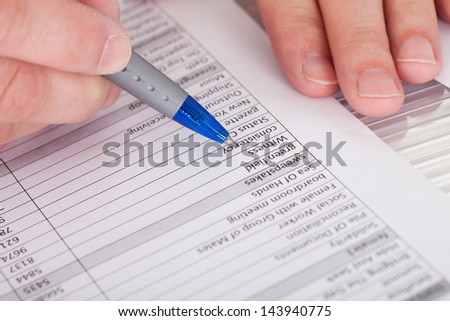 Close-up Photo Of Person Filling Application Form