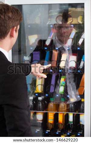 Man Pointing At Chocolate In Display Cake