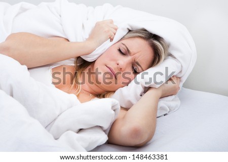 Portrait of a young woman not being able to sleep