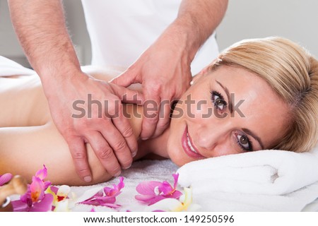 Beautiful Young Woman Getting Message At Spa Salon