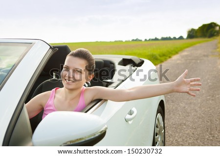 Happy Woman Showing Her Hand While Travelling In Car