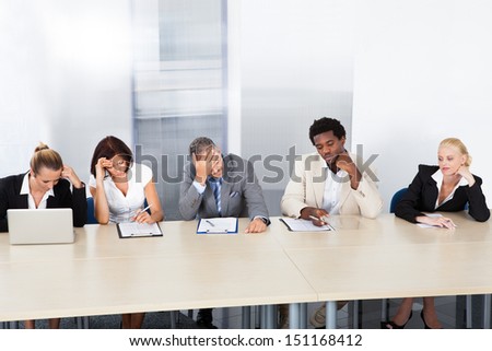 Group Of Tired Corporate Personnel Officers In A Row