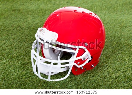 Close-up Of A Red Football Helmet On Field