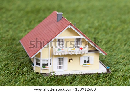 Close-up Of Green Ecological House On Green Grass