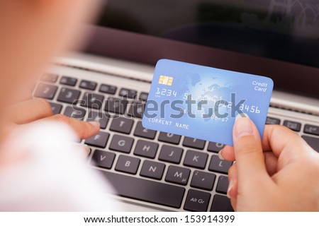 Close-up Of Female Hand With Credit Card Shopping Online