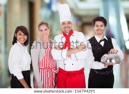 Happy Group Of Restaurant Staff Smiling Indoor