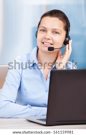 Portrait Of Female Customer Care Executive Working At Office