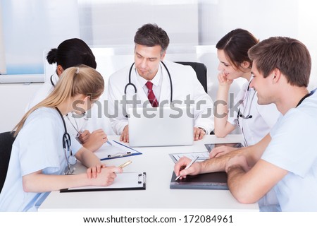 Group Of Doctors Having Meeting In A Hospital