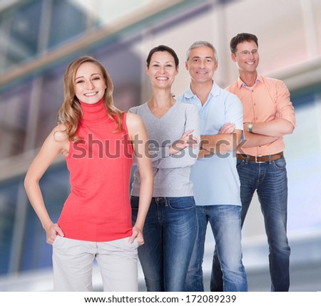 Group Of Happy Confident People Standing In A Row With Arm Crossed