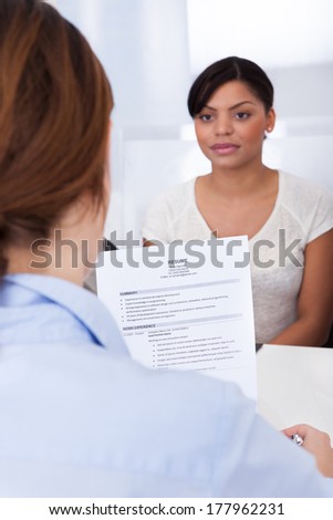 Businesswoman Conducting An Employment Interview With Young Female Applicant