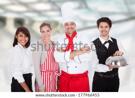 Group Of Happy Restaurant Chef And Waiters Standing Together