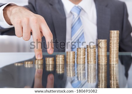 Businessman Finger Go Up To The Top Of Stack Coin With Concept Growth Finance