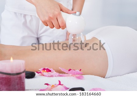 Close-up Of Woman\'s Leg Getting Laser Therapy In Spa