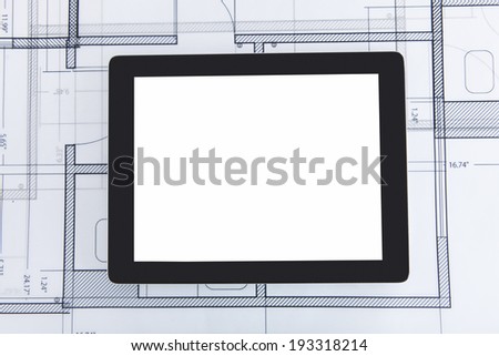 Closeup photo of digital tablet on blueprint