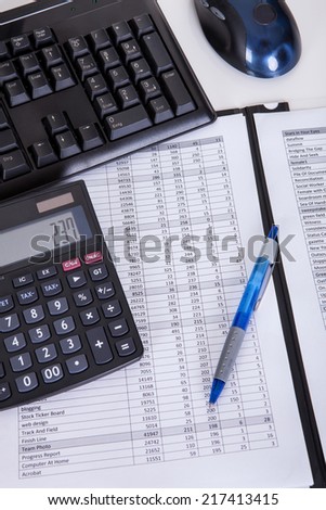 Financial papers calculator and pen. Isolated on white