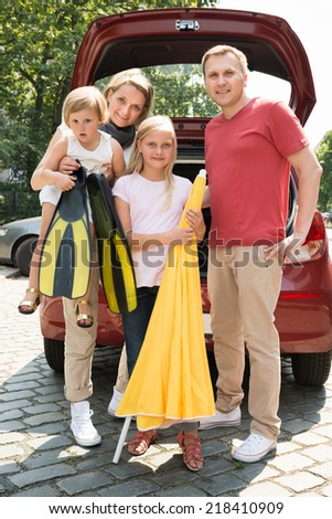 Happy Family Traveling By Car. Outdoors Shot