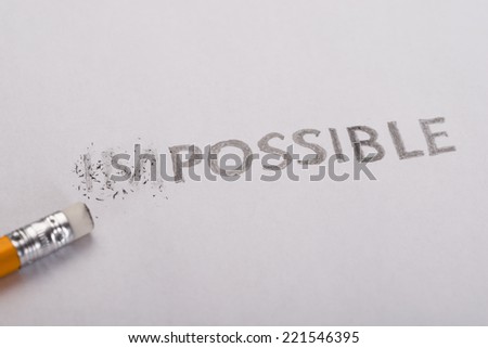 Impossible is possible pencil written letters on paper