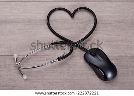 Stethoscope forming heart shape in online medical advice concept