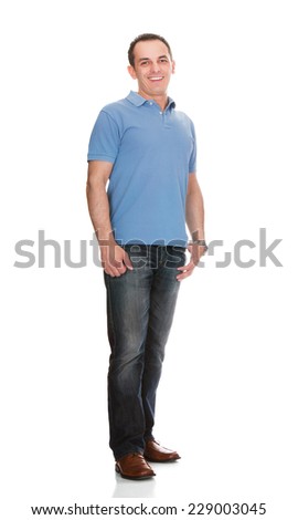 Full length portrait of happy man in casuals standing against white background