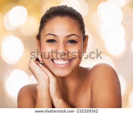Closeup portrait of happy topless woman against colored background