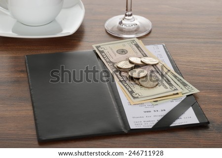 Close-up Of Bill With American Dollars On Wooden Table