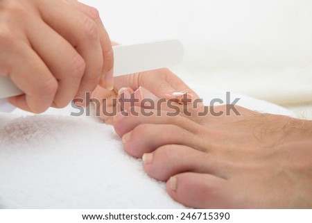 Close-up Photo Of A Manicurist Doing Pedicure