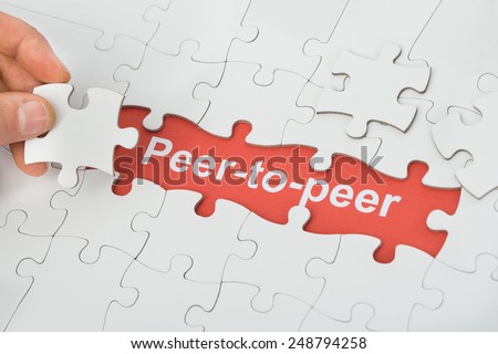 Person Holding Jigsaw Puzzle Piece With Peer-to-peer Text