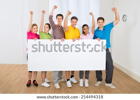 Group Of Multiethnic People Clenching Fist Holding Blank Placard