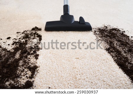 Photo Of Vacuum Cleaner Cleaning Dirt On Carpet