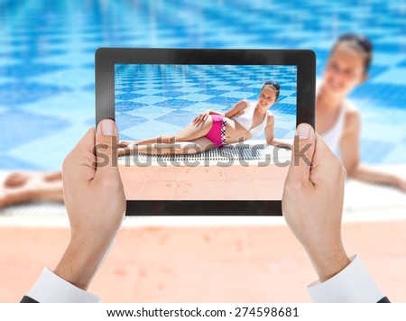 Close-up Of Person Hand Photographing Woman In Bikini