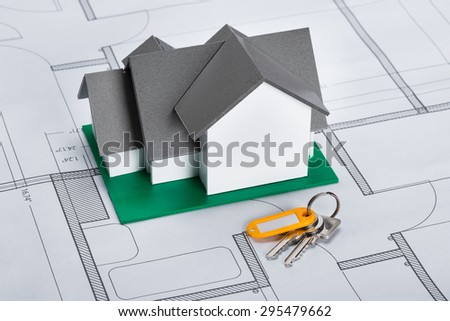 Close-up Of House Model With Keys On Blueprint