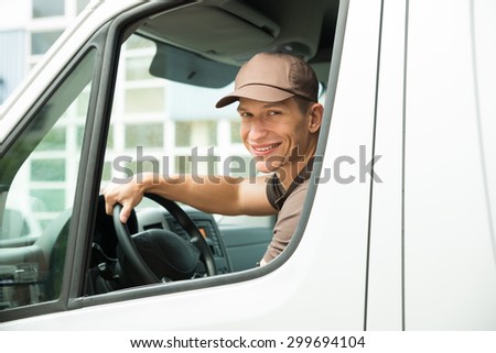 Young Happy Delivery Man Driving Service Delivery Van