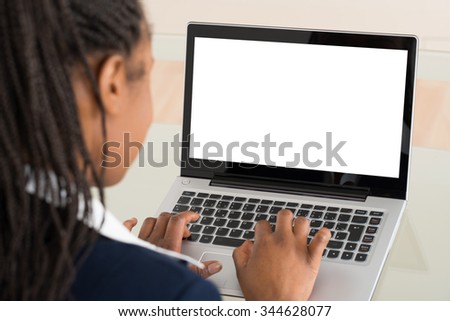 Close-up Of A Young Businesswoman Using Laptop