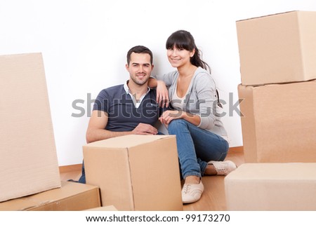Happy young couple moving into new house