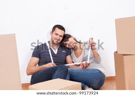Happy young couple moving into new house